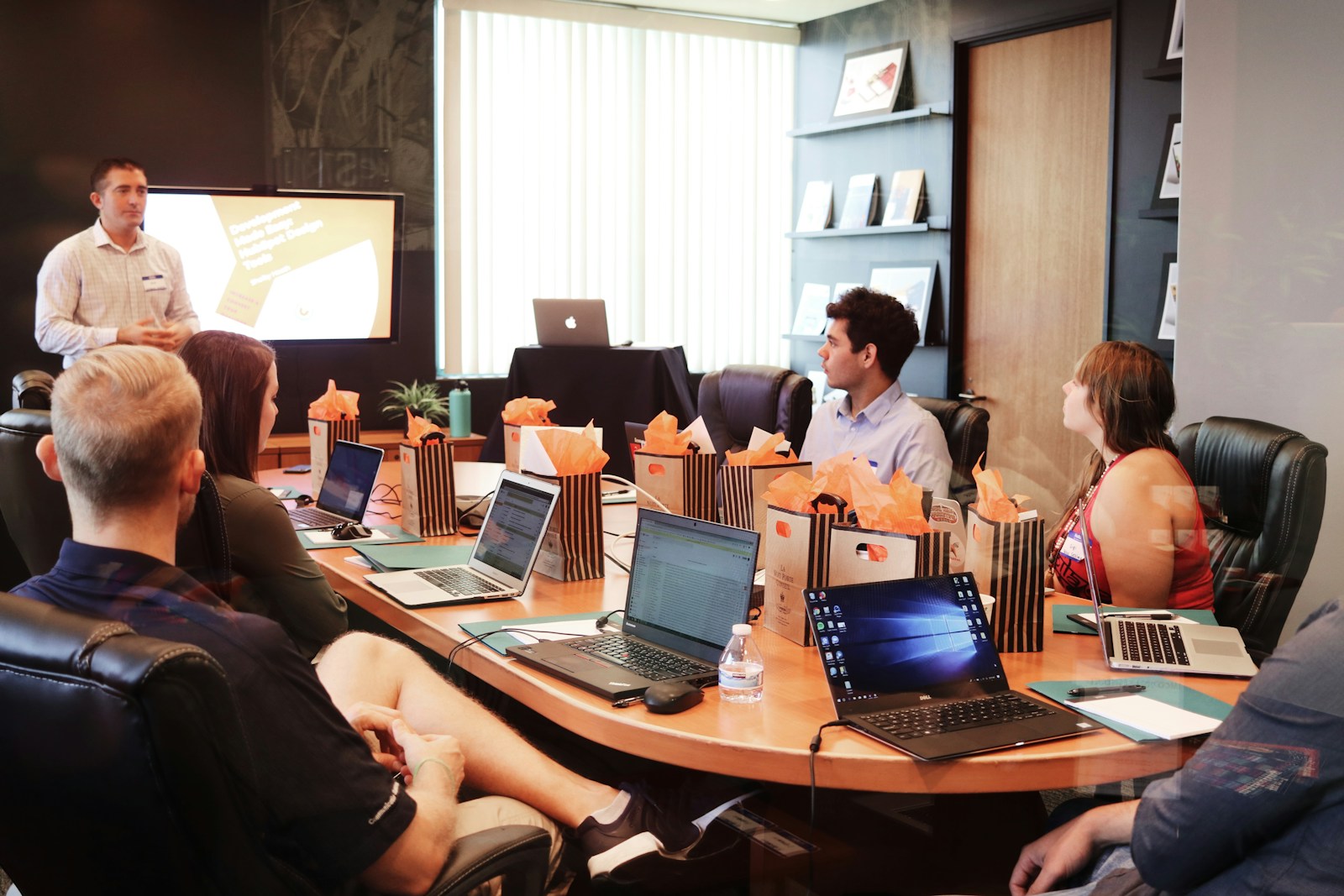 Boardroom counsel session with commercial agreements and case reference materials